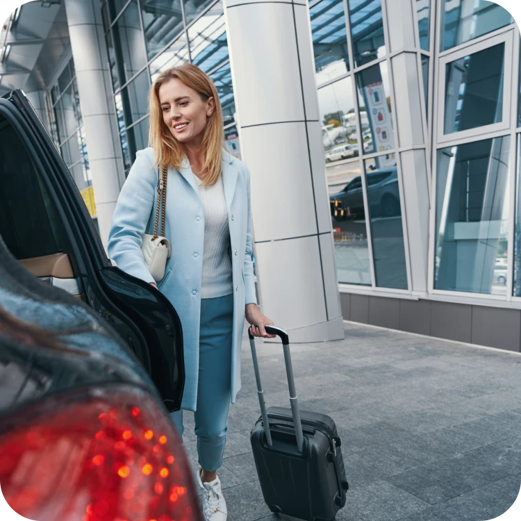 Lady with luggage arriving an airport